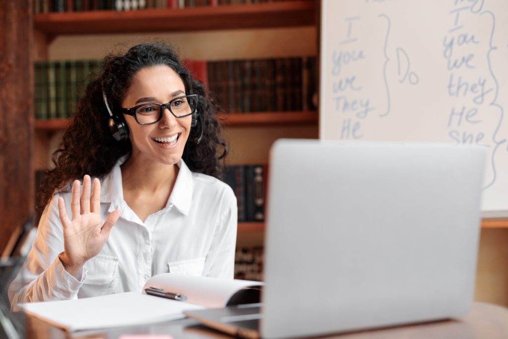 a female student sitting in front of a laptop
